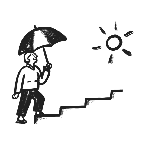a person with an umbrella walking up some steps